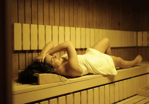 a woman in a sauna.