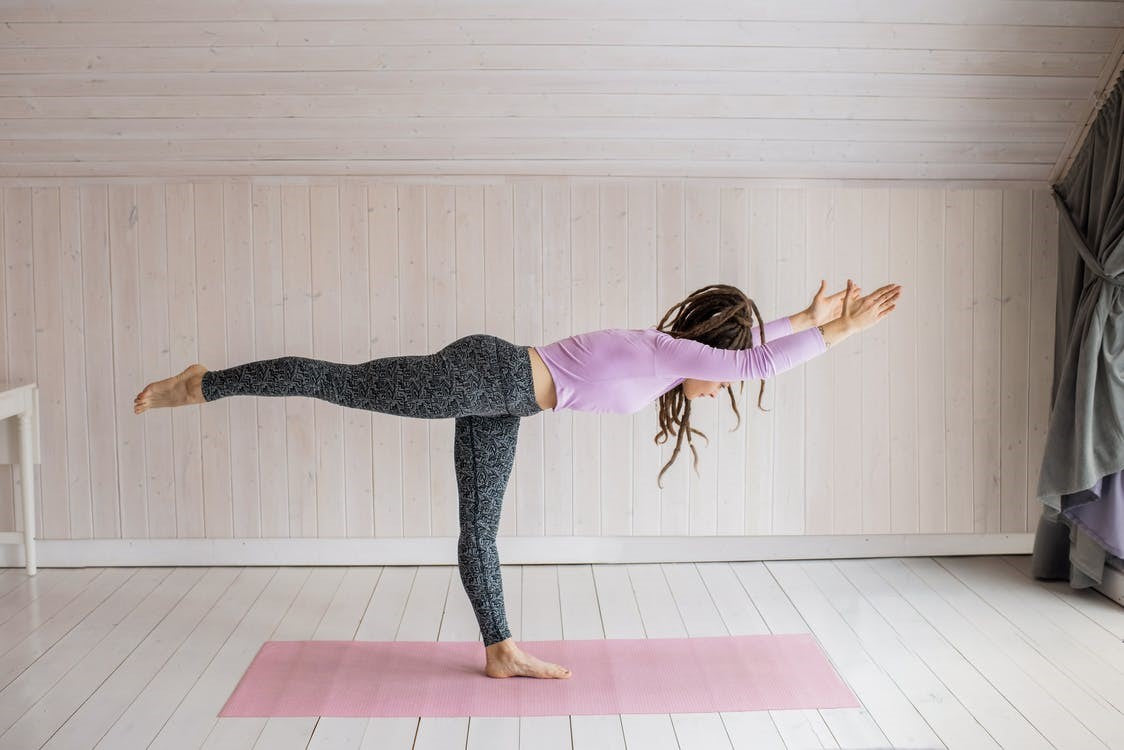 a woman doing yoga.